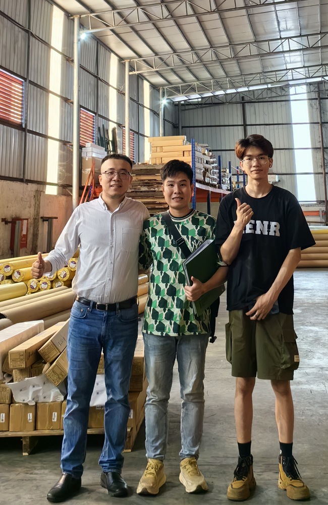 Taking photos with clients at the advertising materials trade show.