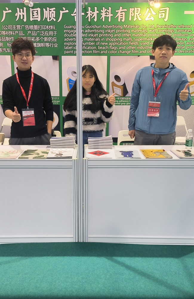 Taking photos with clients at the advertising materials trade show.