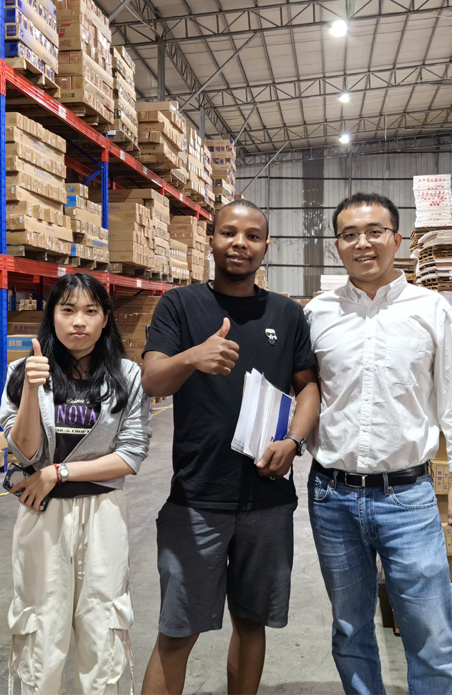 Taking photos with clients at the advertising materials trade show.