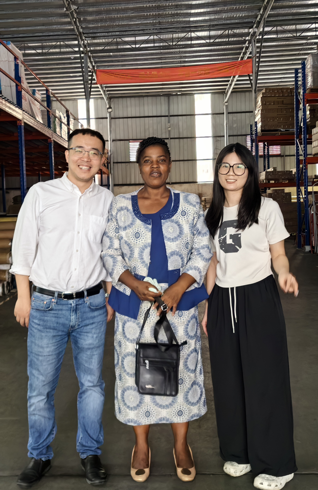 Taking photos with clients at the advertising materials trade show.