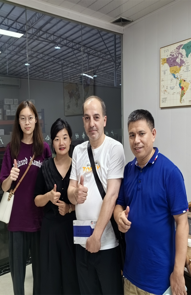 Taking photos with clients at the advertising materials trade show.