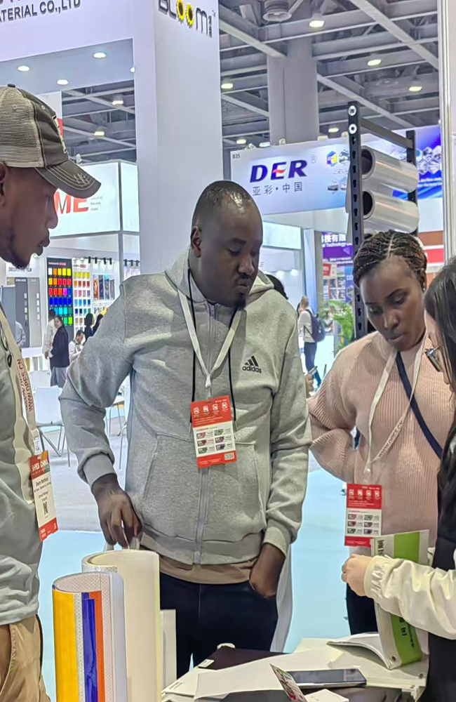 Taking photos with clients at the advertising materials trade show.