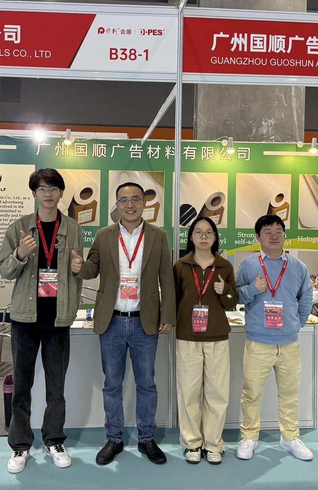 Taking photos with clients at the advertising materials trade show.