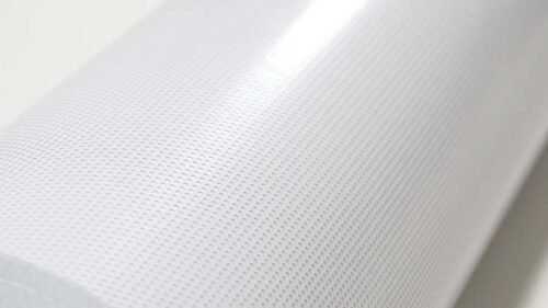 Real-life photos of one-way transparent vinyl film rolls.