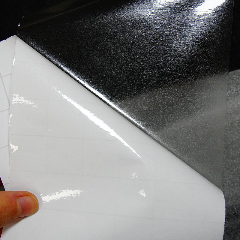 White-backed cold laminating film, 85 microns thick, for protecting bus advertising graphics.